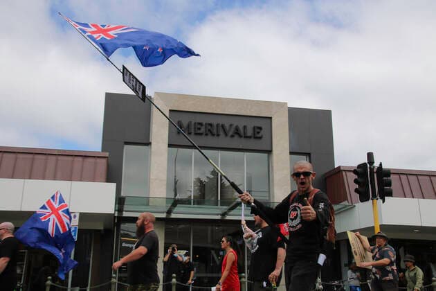 January 22, 2022, Christchurch, Canterbury, New Zealand: Protesters march while holding New Zealand flags during the antivax protest in Merivale..Protesters take to the streets in the affluent suburb of Merivale in protest against the mandatory Covid19 vaccination. Christchurch New Zealand - ZUMAs197 20220122_zaa_s197_039 Copyright: xAdamxBradleyx