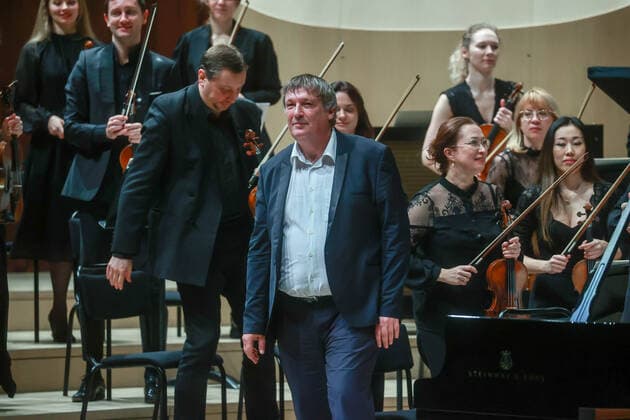 MOSCOW, RUSSIA â€” JANUARY 22, 2022: Pianist Boris Berezovsky (C front) acknowledges the audience during a concert in which he performed with the Mariinsky Theatre Symphony Orchestra at Zaryadye Concert Hall. The concert was organised by Valery Gergiev Foundation. Sergei Fadeichev TASS  TS11FFE2