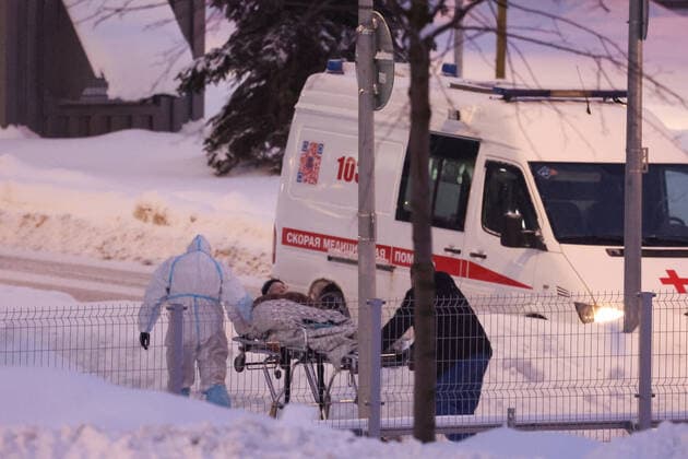 MOSCOW, RUSSIA â€“ JANUARY 22, 2022: A patient on a stretcher is taken to the admission ward at the Novomoskovsky Multipurpose Medical Centre that offers treatment to patients with suspected COVID-19 coronavirus infection, in Kommunarka, Novomoskovsky Administrative District of Moscow. Since the start of the pandemic, Moscow has confirmed more than 2,157,000 cases of COVID-19. Since 21 January 2022, the number of new confirmed cases has been increasing in the Russian capital by more than 16,000 daily. Vyacheslav Prokofyev TASS  TS120005