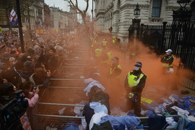 . 22 01 2022. London, United Kingdom. Protesters throw flares and NHS clothing during a freedom rally outside Downing Street in London.  xHowardxJonesx xi-Imagesx IIM-23033-0001