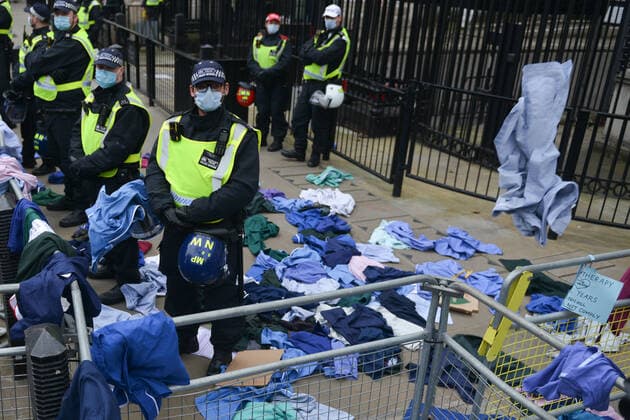 . 22 01 2022. London, United Kingdom. Protesters throw NHS clothing during a freedom rally outside Downing Street in London.  xHowardxJonesx xi-Imagesx IIM-23033-0012