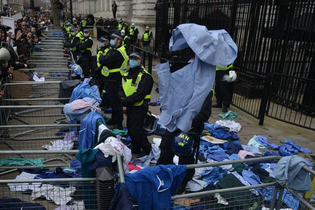 . 22 01 2022. London, United Kingdom. Protesters throw NHS clothing during a freedom rally outside Downing Street in London.  xHowardxJonesx xi-Imagesx IIM-23033-0017