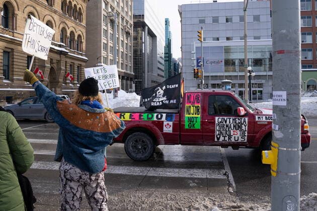 January 22, 2022, Ottawa, ON, CANADA: A car with various protest slogans drives past as demonstrators protest against public health measures taken by authorities to curb the spread of COVID-19, in Ottawa, Saturday, Jan. 22, 2022. Ottawa CANADA  - ZUMAc35_ 20220122_zaf_c35_011 Copyright: xMichaelxChisholmx