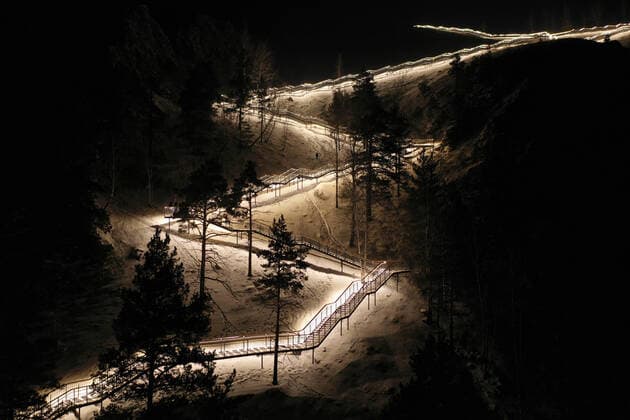 KRASNOYARSK, RUSSIA â€“ DECEMBER 25, 2021: Stairs leading from the Bazaikha River to the Torgashinsky mountain range is illuminated at night, the 1200-metre long stairs consists of 1683 steps. Andrei Samsonov TASS  TS120119