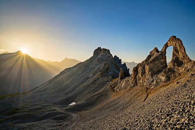 Laiguille Percee arch at sunrise at Laiguille Percee Rock, Vanoise National Park, France, ANSF00193