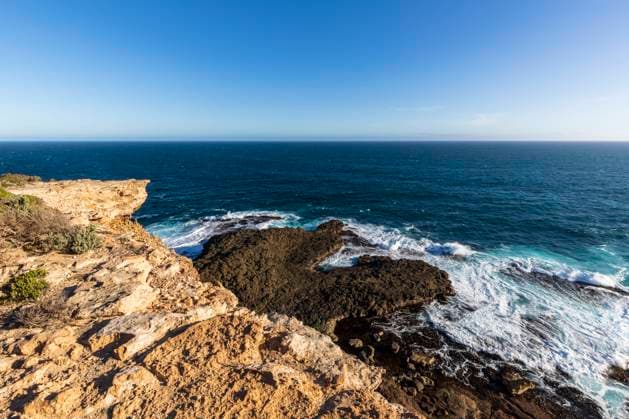Creative Highlights World Australia, Victoria, Shore of Cape Nelson State Park with clear line of horizon over sea in background, FOF12683