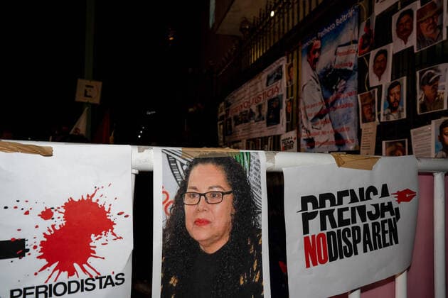 January 25, 2022, Mexico, Federal District, Mexico: A picture of Lourdes Maldonado hangs next to a sign saying press, don t shoot during the demonstration..Following the murder of three Mexican journalists in the first weeks of 2022, hundreds of journalists came together to protest outside the offices of the Ministry of Interior in Mexico City. It was part of a simultaneous national protest that took place 38 cities. Mexico Mexico - ZUMAs197 20220125_zaa_s197_162 Copyright: xLexiexHarrison-Crippsx