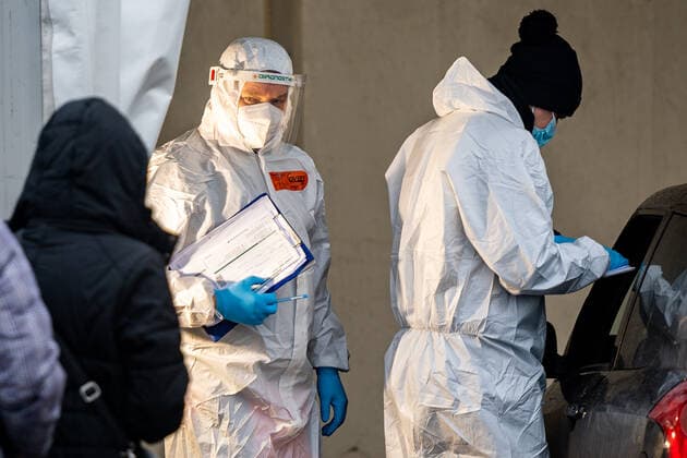 January 26, 2022, Gdynia, Poland: Medics wearing a personal protective equipment (PPE) gears are seen at the drive thru Covid-19 testing point in Gdynia..Poland widens Covid-19 testing points as Covid-19 cases hit a record, 53,420 cases since the beginning of the pandemic. Gdynia Poland - ZUMAs197 20220126_zaa_s197_018 Copyright: xMateuszxSlodkowskix