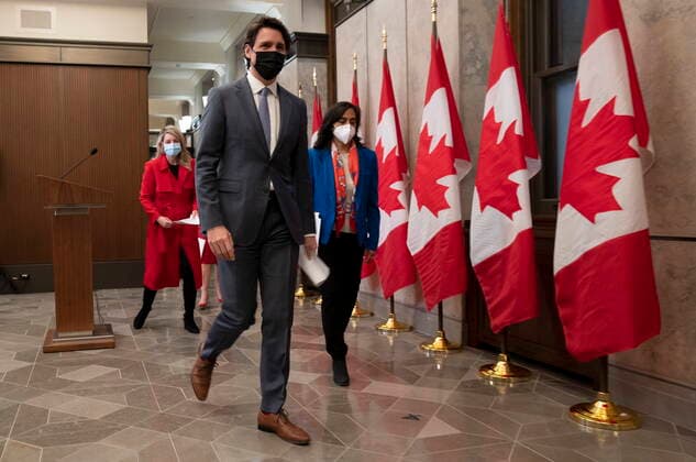 January 26, 2022, Ottawa, ON, Canada: Canadian Prime Minister Justin Trudeau leaves a news conference with Foreign Affairs Minister Melanie Joly and Defence Minister Anita Anand following a cabinet retreat, Wednesday, Jan. 26, 2022 in Ottawa. Trudeau says Canada is extending its mission to train Ukrainian soldiers by three years. Ottawa Canada  - ZUMAc35_ 20220126_zaf_c35_013 Copyright: xAdrianxWyldx