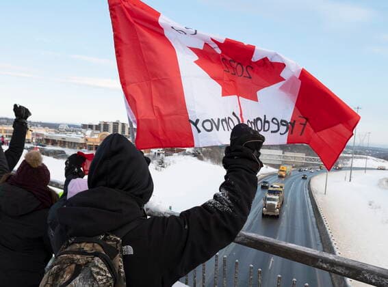January 28, 2022, LEVIS, PQ, Canada: Hundreds of people gather on an overpass by TransCanada Highway 20 to show their support to truckers heading to Ottawa to protest against COVID-19 restrictions, Friday, Jan. 28, 2022 in Levis, Que. LEVIS Canada  - ZUMAc35_ 20220128_zaf_c35_028 Copyright: xJacquesxBoissinotx