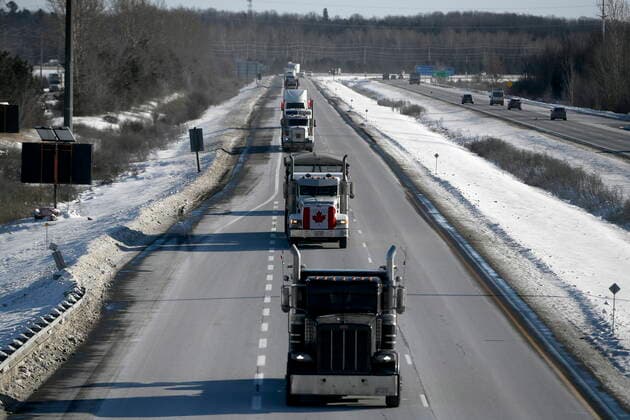 January 28, 2022, Ottawa, ON, CAN: Trucks participating in a cross-country convoy protesting a federal vaccine mandate for truckers, make their way along Highway 416 into Ottawa, Friday, Jan. 28, 2022. Ottawa CAN  - ZUMAc35_ 20220128_zaf_c35_038 Copyright: xJustinxTangx