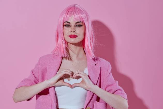 IMAGO Creative, Lifestyle, Barbiecore Positive young woman bright makeup pink hair glamor Studio Model Positive young woman bright makeup pink hair glamor Studio Model. High quality photo Copyright: xx 43531760