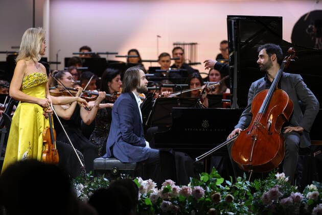 MOSCOW, RUSSIA - JANUARY 29, 2022: German violinist Anne-Sophie Mutter, Russian pianist Daniil Trifonov and Spanish cellist Pablo Ferrandez (L-R) perform at Tchaikovsky Concert Hall during a gala concert celebrating 100 years since the opening of the Moscow Philharmonic Society. Artyom Geodakyan TASS  TS120993