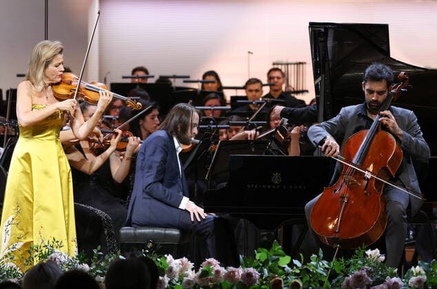 MOSCOW, RUSSIA - JANUARY 29, 2022: German violinist Anne-Sophie Mutter, Russian pianist Daniil Trifonov and Spanish cellist Pablo Ferrandez (L-R front) perform at Tchaikovsky Concert Hall during a gala concert celebrating 100 years since the opening of the Moscow Philharmonic Society. Artyom Geodakyan TASS  TS1209A7