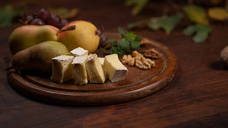 Snacks set: cheese, grapes, pear and three walnuts on a wooden table. Brie cheese with fruits, grapes, walnuts on a dark wooden plate and wooden board Snacks set: cheese, grapes, pear and three walnuts on a wooden table. Brie cheese with fruits, grapes, walnuts on a dark wooden plate and wooden board. Copyright: xsvyatoslavxlipinskiyx 43587168