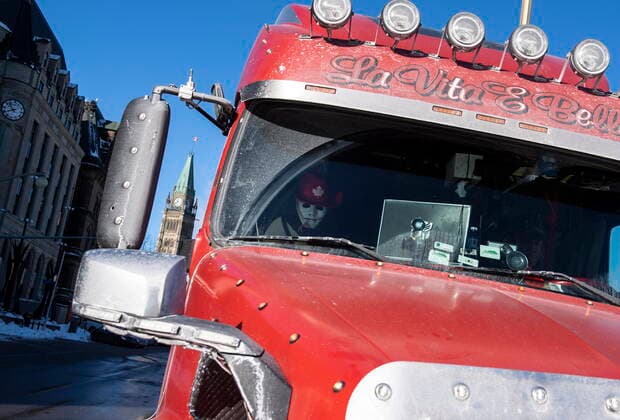 January 30, 2022, Ottawa, ON, CAN: A mask wearing a hat is seen on the passenger seat of a truck parked on Elgin Street during a rally against COVID-19 restrictions on Parliament Hill, which began as a cross-country convoy protesting a federal vaccine mandate for truckers, in Ottawa, on Sunday, Jan. 30, 2022. Ottawa CAN  - ZUMAc35_ 20220130_zaf_c35_013 Copyright: xJustinxTangx