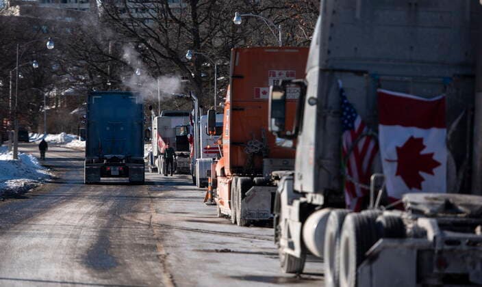 January 30, 2022, Ottawa, ON, CAN: Trucks participating in a rally against COVID-19 restrictions, which began as a cross-country convoy protesting a federal vaccine mandate for truckers, are parked along Queen Elizabeth Drive in Ottawa, on Sunday, Jan. 30, 2022. Ottawa CAN  - ZUMAc35_ 20220130_zaf_c35_018 Copyright: xJustinxTangx