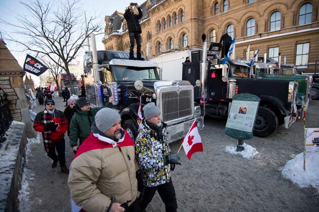 January 30, 2022, Ottawa, ON, CAN: Trucks are parked along the sidewalk and on Wellington Street outside the Office of the Prime Minister and Privy Council during a rally against COVID-19 restrictions on Parliament Hill, which began as a cross-country convoy protesting a federal vaccine mandate for truckers, in Ottawa, on Sunday, Jan. 30, 2022. Ottawa Canada  - ZUMAc35_ 20220130_zaf_c35_007 Copyright: xJustinxTangx