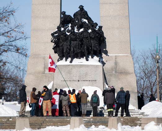 January 30, 2022, Ottawa, ON, CAN: People surround the Tomb of the Unknown Soldier at the National War Memorial during a rally against COVID-19 restrictions in Ottawa, which began as a cross-country convoy protesting a federal vaccine mandate for truckers, on Sunday, Jan. 30, 2022. Ottawa Canada  - ZUMAc35_ 20220130_zaf_c35_011 Copyright: xJustinxTangx