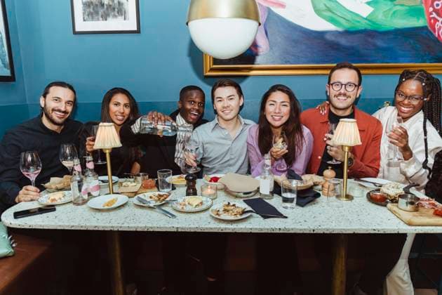 Portrait of smiling multiracial friends with wineglasses at restaurant Sweden, Stockholm, model released, property released Copyright: xMaskotx , MA91609