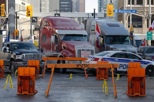 February 1, 2022, Ottawa, ON, CANADA: Trucks are blocked by police barricades as a rally against COVID-19 restrictions, which began as a cross-country convoy protesting a federal vaccine mandate for truckers continues in Ottawa on Tuesday, February 1, 2022. As organizers behind the demonstration that has seized the nation s capital say they are preparing to stick around even longer by distributing fuel and supplies to the trucks clogging up Ottawa streets, politicians at all levels of government are asking them to roll out. Ottawa CANADA  - ZUMAc35_ 20220201_zaf_c35_072 Copyright: xPatrickxDoylex