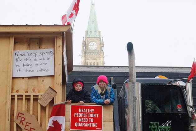 February 1, 2022, Ottawa, ON, CANADA: Children stand on top of a truck in front of Parliament Hill as a rally against COVID-19 restrictions, which began as a cross-country convoy protesting a federal vaccine mandate for truckers, continues in Ottawa, on Tuesday, February 1, 2022. As organizers behind the demonstration that has seized the nation s capital say they are preparing to stick around even longer by distributing fuel and supplies to the trucks clogging up Ottawa streets, politicians at all levels of government are asking them to roll out. Ottawa CANADA - ZUMAc35_ 20220201_zaf_c35_077 Copyright: xPatrickxDoylex