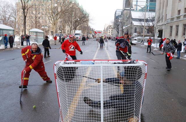 February 1, 2022, Ottawa, ON, CANADA: Truckers and their supporters play street hockey on Wellington Street as a rally against COVID-19 restrictions, which began as a cross-country convoy protesting a federal vaccine mandate for truckers, continues in Ottawa, on Tuesday, February 1, 2022. As organizers behind the demonstration that has seized the nation s capital say they are preparing to stick around even longer by distributing fuel and supplies to the trucks clogging up Ottawa streets, politicians at all levels of government are asking them to roll out. Ottawa CANADA - ZUMAc35_ 20220201_zaf_c35_081 Copyright: xPatrickxDoylex
