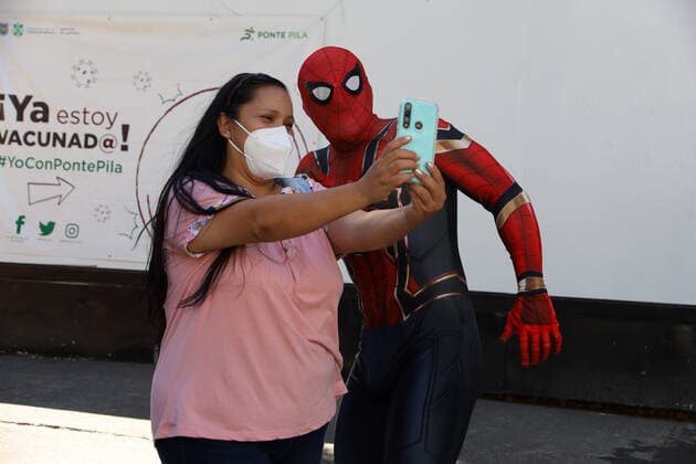 Sputnik V Booster Vaccination Campaign MEXICO CITY, MEXICO - FEBRUARY 1, 2022: A woman takes a selfie with a Spiderman after receive the booster dose of Sputnik V vaccine inside Campo Marte during the vaccination campaign to prevent infections of Covid-19 variants. On February 1, 2022 in Mexico City; Mexico. (Photo by Luis Barron Eyepix Group) Copyright: xLuisxBarronx xEyepixxGroupx EYEPIXGROUP_LB_01022022_55232