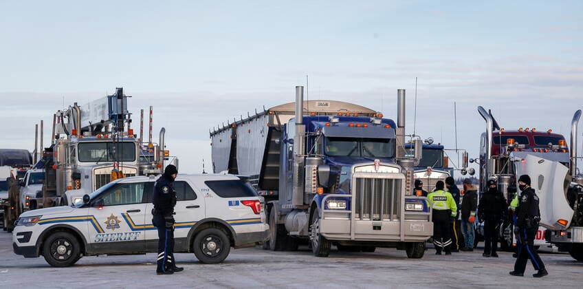 February 3, 2022, Milk River, AB, CANADA: A commercial vehicle is allowed through as anti-COVID-19 vaccine mandate demonstrators block the highway in Milk River, Alta., Thursday, Feb. 3, 2022. Milk River CANADA  - ZUMAc35_ 20220203_zaf_c35_075 Copyright: xJeffxMcintoshx