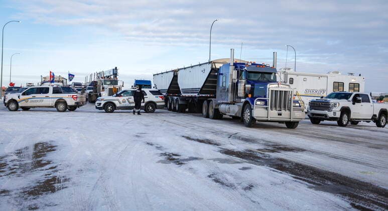 February 3, 2022, Milk River, AB, CANADA: A commercial vehicle is allowed through as anti-COVID-19 vaccine mandate demonstrators block the highway in Milk River, Alta., Thursday, Feb. 3, 2022. Milk River CANADA  - ZUMAc35_ 20220203_zaf_c35_076 Copyright: xJeffxMcintoshx