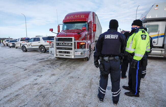 February 3, 2022, Milk River, AB, CANADA: A commercial vehicle is allowed through as anti-COVID-19 vaccine mandate demonstrators block the highway in Milk River, Alta., Thursday, Feb. 3, 2022. Milk River CANADA  - ZUMAc35_ 20220203_zaf_c35_085 Copyright: xJeffxMcintoshx