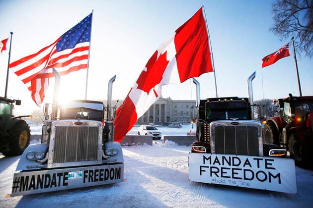 February 4, 2022, Winnipeg, Manitoba, Canada: People rally against provincial and federal COVID-19 vaccine mandates and in support of Ottawa protestors outside the Manitoba Legislature in Winnipeg. Winnipeg Canada  - ZUMAc35_ 20220204_zaf_c35_091 Copyright: xJohnxWoodsx