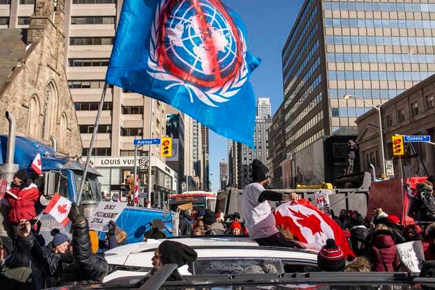 February 5, 2022, Toronto, Ontario, Canada: Protesters gather on the streets on Toronto in opposition of COVID-19 measures and vaccine mandates imposed by the Justin Trudeau government. Organized by the Ã¢â‚¬oeFreedom ConvoyÃ¢â‚¬Â, the demonstration began with a cross-country trek opposing the federal governmentÃ¢â‚¬â ¢s vaccine mandate for cross-border truckers. Toronto Canada - ZUMAc232 20220205_zip_c232_011 Copyright: xGilesxCampbellx