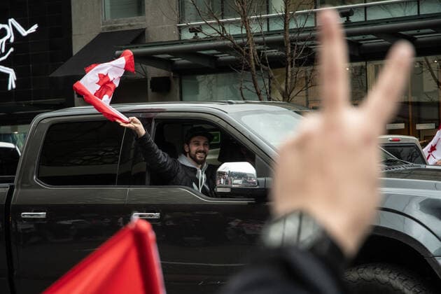 February 5, 2022, Vancouver, British Columbia, Canada: Protectors against COVID-19 safety mandates take to the streets of downtown Vancouver Feb. 5. A convoy of hundreds of vehicles travelled from several nearby municipalities to show their support for the so-called Freedom Convoy of truckers, who brought their protest of mandated vaccines for travel to and from the United States to the nationÃ¢â‚¬â ¢s capital, Ottawa, Ontario, bringing parts of the city to a stand still for the past five days. Vancouver Canada - ZUMAb217 20220205_zip_b217_005 Copyright: xQuinnxBenderx