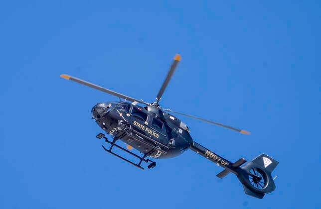 February 11, 2022, Sedillo, New Mexico, USA: Abq Journal.Several agencies including BCSO, APD, FBI, DEA as well as NM State Police responded to a scene where a State Trooper was shot and wounded near Sedillo Hill, New Mexico just east of Albuquerque Friday morning. Pictured is a State police helicopter helping with the search for individuals involved int he shooting of the state trooper..Sedillo, New Mexico Albuquerque Journal. Sedillo USA - ZUMAab1_ 20220211_zaf_ab1_005 Copyright: xRobertoxE.xRosalesx