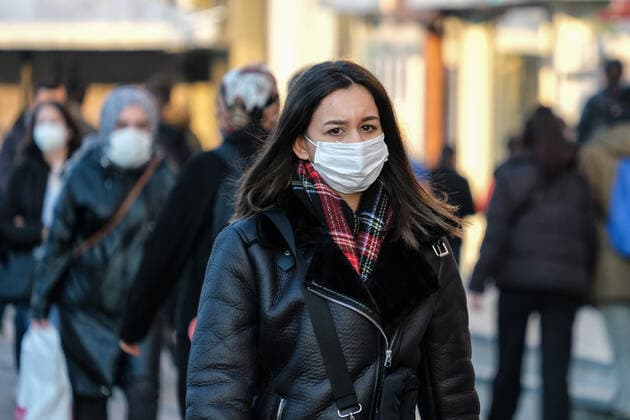 People wearing face masks walk on a street in Istanbul, Turkey, on February 11, 2022. Turkey reports 95,065 newly confirmed COVID-19 cases. ( Copyright: CumhurxYetme 17424766