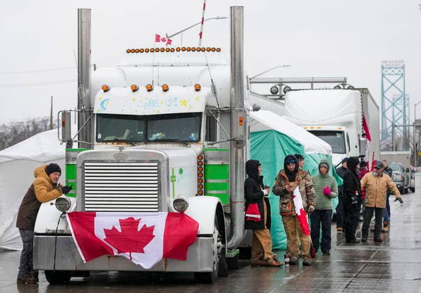 February 11, 2022, Windsor, Ontario, Canada: Truckers and supporters block the access leading from the Ambassador Bridge, linking Detroit and Windsor, as truckers and their supporters continue to protest against COVID-19 vaccine mandates and restrictions. A Canadian judge has granted a court order to end a truckers blockade of a vital trade link with the US. The chief justice of Ontario s Superior Court of Justice said the injunction would come into effect at 19:00 local time (midnight GMT) on Friday. Windsor Canada  - ZUMAc35_ 20220211_zaf_c35_115 Copyright: xNathanxDenettex
