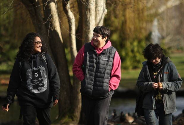 February 11, 2022, VICTORIA, BC, CANADA: Bear Henry is joined by friends Nakita Sekhon, left, and Shae Perkins during a press conference at Beacon Hill Park in Victoria, Friday, Feb. 11, 2022. Henry went missing for 74 days while participating in the old-growth logging protests in Fairy Creek in the Cowichan Valley area near Port Renfrew. Henry was found by loggers in the area before returning home safely. VICTORIA CANADA  - ZUMAc35_ 20220211_zaf_c35_181 Copyright: xChadxHipolitox