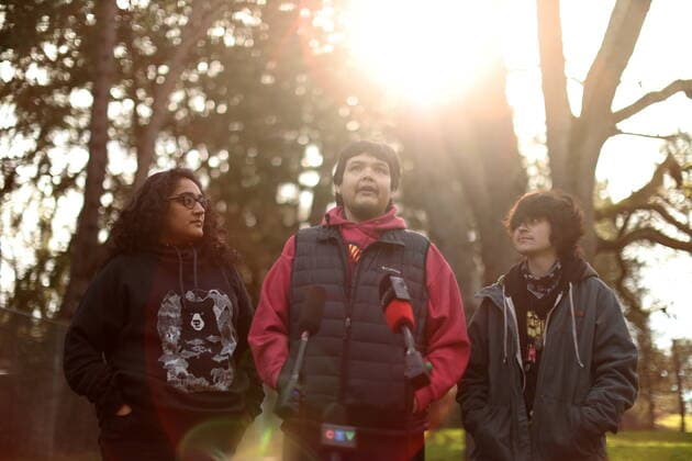 February 11, 2022, VICTORIA, BC, CANADA: Bear Henry is joined by friends Nakita Sekhon, left, and Shae Perkins during a press conference at Beacon Hill Park in Victoria, Friday, Feb. 11, 2022. Henry went missing for 74 days while participating in the old-growth logging protests in Fairy Creek in the Cowichan Valley area near Port Renfrew. Henry was found by loggers in the area before returning home safely. VICTORIA CANADA  - ZUMAc35_ 20220211_zaf_c35_193 Copyright: xChadxHipolitox