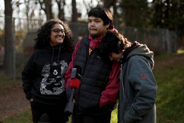 February 11, 2022, VICTORIA, BC, CANADA: Bear Henry is joined by friends Nakita Sekhon, left, and Shae Perkins during a press conference at Beacon Hill Park in Victoria, Friday, Feb. 11, 2022. Henry went missing for 74 days while participating in the old-growth logging protests in Fairy Creek in the Cowichan Valley area near Port Renfrew. Henry was found by loggers in the area before returning home safely. VICTORIA CANADA  - ZUMAc35_ 20220211_zaf_c35_196 Copyright: xChadxHipolitox