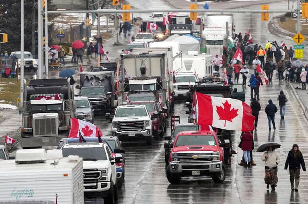February 11, 2022, Windsor, Canada: Truckers and supporters block the access leading from the Ambassador Bridge, linking Detroit and Windsor, as truckers and their supporters continue to protest against COVID-19 vaccine mandates and restrictions, in Windsor, Ont., Friday, Feb. 11, 2022. WINDSOR CANADA  - ZUMAc35_ 20220211_zaf_c35_146 Copyright: xNathanxDenettex