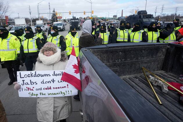February 12, 2022, Windsor, ON, CANADA: Police enforce an injunction at a demonstration which has blocked traffic across the Ambassador Bridge by protesters against COVID-19 restrictions, in Windsor, Ont., Saturday, Feb. 12, 2022. Windsor CANADA  - ZUMAc35_ 20220212_zaf_c35_130 Copyright: xNathanxDenettex