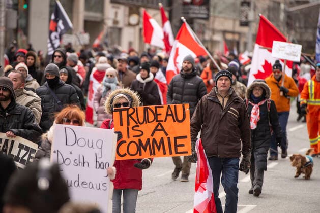 February 12, 2022, Toronto, Ontario, Canada: Protesters gather on the streets on Toronto for a second week in opposition of COVID-19 measures and vaccine mandates imposed by the Justin Trudeau government. Organized by the Ã¢â‚¬oeFreedom ConvoyÃ¢â‚¬Â, the demonstration began with a cross-country trek opposing the federal governmentÃ¢â‚¬â ¢s vaccine mandate for cross-border truckers. Toronto Canada - ZUMAc232 20220212_zip_c232_007 Copyright: xGilesxCampbellx