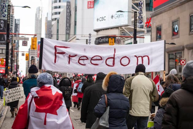 February 12, 2022, Toronto, Ontario, Canada: Protesters gather on the streets on Toronto for a second week in opposition of COVID-19 measures and vaccine mandates imposed by the Justin Trudeau government. Organized by the Ã¢â‚¬oeFreedom ConvoyÃ¢â‚¬Â, the demonstration began with a cross-country trek opposing the federal governmentÃ¢â‚¬â ¢s vaccine mandate for cross-border truckers. Toronto Canada - ZUMAc232 20220212_zip_c232_012 Copyright: xGilesxCampbellx