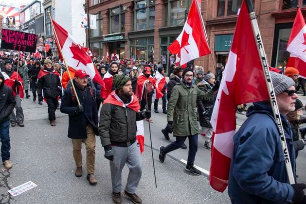 February 12, 2022, Toronto, Ontario, Canada: Protesters gather on the streets on Toronto for a second week in opposition of COVID-19 measures and vaccine mandates imposed by the Justin Trudeau government. Organized by the Ã¢â‚¬oeFreedom ConvoyÃ¢â‚¬Â, the demonstration began with a cross-country trek opposing the federal governmentÃ¢â‚¬â ¢s vaccine mandate for cross-border truckers. Toronto Canada - ZUMAc232 20220212_zip_c232_013 Copyright: xGilesxCampbellx