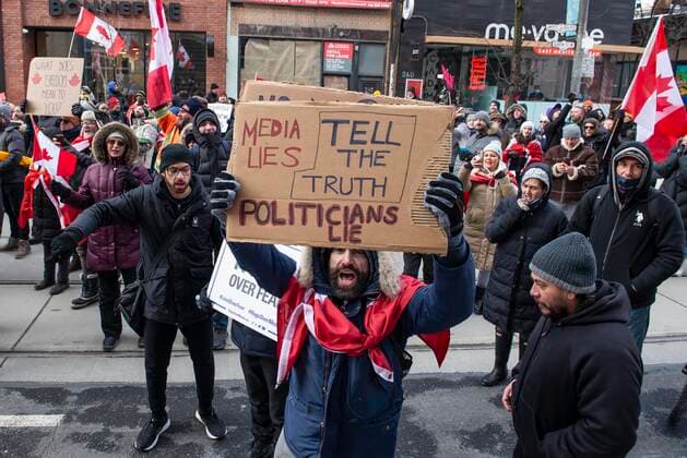 February 12, 2022, Toronto, Ontario, Canada: Protesters gather on the streets on Toronto for a second week in opposition of COVID-19 measures and vaccine mandates imposed by the Justin Trudeau government. Organized by the Ã¢â‚¬oeFreedom ConvoyÃ¢â‚¬Â, the demonstration began with a cross-country trek opposing the federal governmentÃ¢â‚¬â ¢s vaccine mandate for cross-border truckers. Toronto Canada - ZUMAc232 20220212_zip_c232_016 Copyright: xGilesxCampbellx