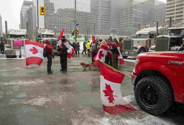 February 12, 2022, Ottawa, on, Canada: Anti-mandate protesters block a downtown intersection during a demonstration against COVID-19 restrictions, in Ottawa, Saturday, Feb. 12, 2022. Ottawa Canada  - ZUMAc35_ 20220212_zaf_c35_137 Copyright: xFrankxGunnx