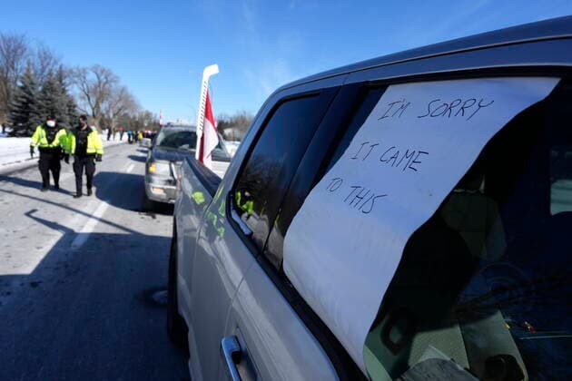 February 13, 2022, Ottawa, ON, CAN: An apologetic note is seen in the window of a protester s unattended pickup truck as local residents counter protest to stop vehicles driving in a convoy from making their way along Riverside Drive at Bank Street en route to Parliament Hill, on the 17th day of a protest against COVID-19 measures that has grown into a broader anti-government protest, in Ottawa, on Sunday, Feb. 13, 2022. Ottawa CAN  - ZUMAc35_ 20220213_zaf_c35_076 Copyright: xJustinxTangx