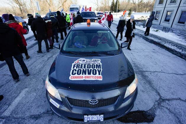 February 13, 2022, Ottawa, ON, CAN: A vehicle with a sticker for the group Canada Unity s Freedom Convoy is stopped by counter protesters stopping vehicles from driving in a convoy en route to Parliament Hill, on the 17th day of a protest against COVID-19 measures that has grown into a broader anti-government protest, in Ottawa, on Sunday, Feb. 13, 2022. Ottawa CAN  - ZUMAc35_ 20220213_zaf_c35_077 Copyright: xJustinxTangx