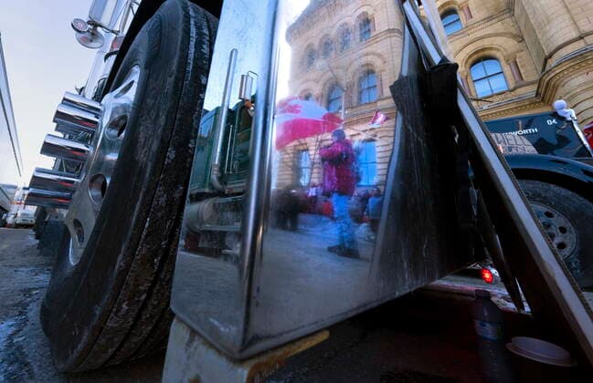 February 13, 2022, Ottawa, on, Canada: Protesters are reflected in the bumper of a truck during an anti-mandate protest on Parliament Hill in Ottawa on Sunday, February 13, 2022. Ottawa Canada  - ZUMAc35_ 20220213_zaf_c35_094 Copyright: xFrankxGunnx